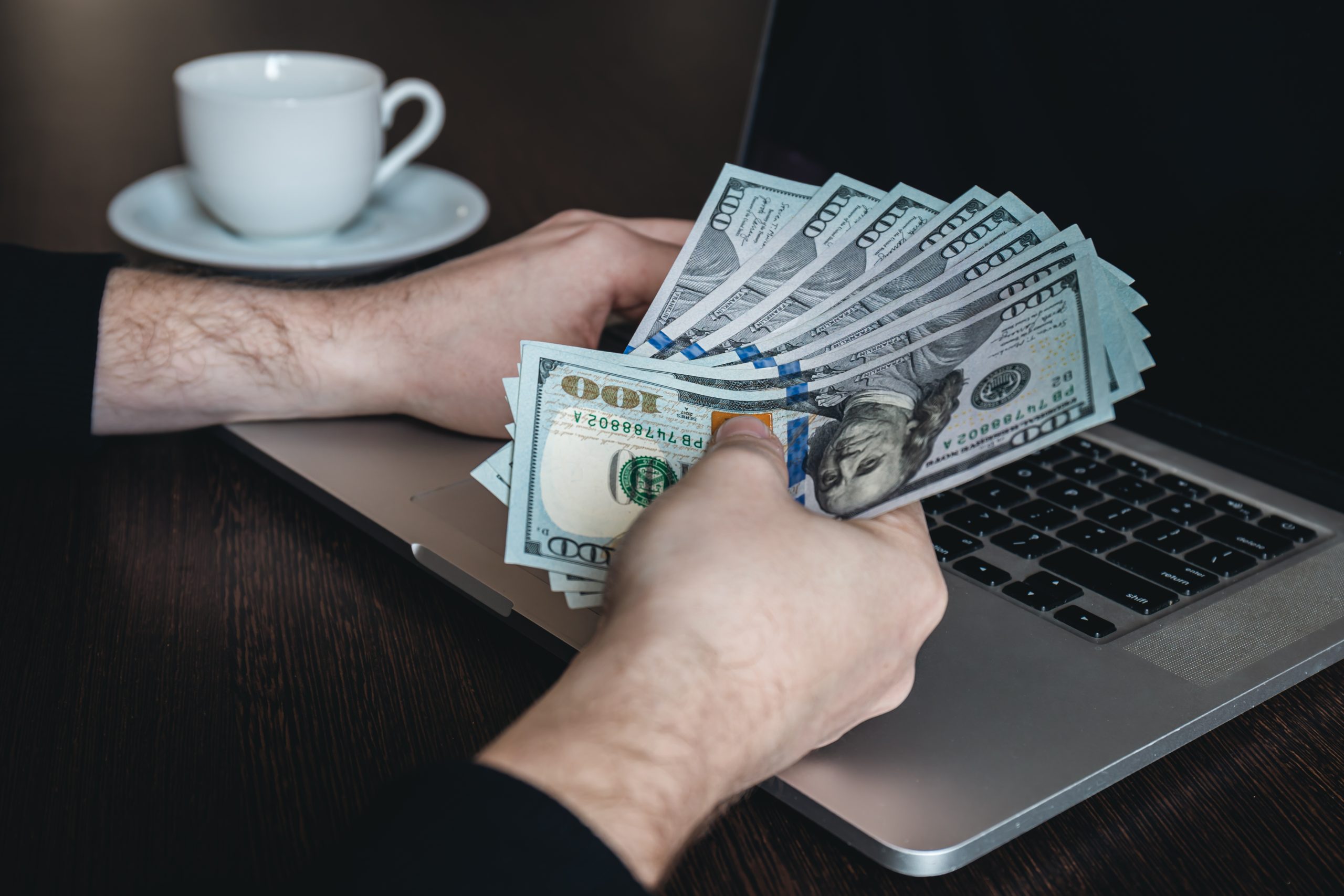 dollar bills in male hands