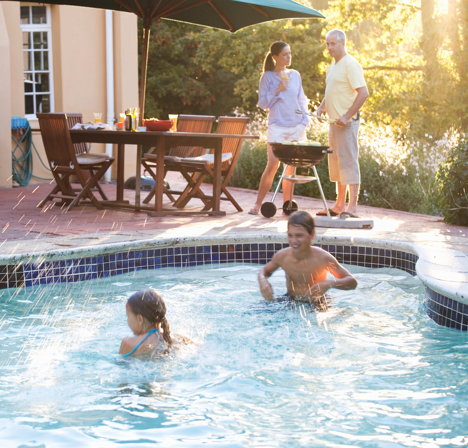 children-swimming-in-the-pool-at-a-family-barbeque-2026-03-26-09-34-44-utc